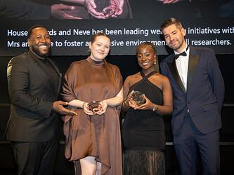 Research Live young researcher of the year 2025 neve savage and jerryanne hagan-tetteh, on stage at the MRS Awards